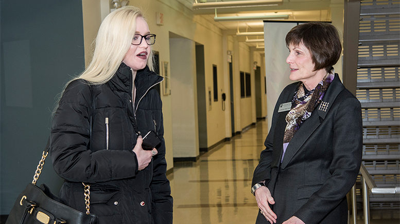 Waubonsee Community College President Christine Sobek (right) chats with a student.