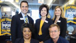 President Mary Graham (back center) with her team at Mississippi Gulf Coast Community College.
