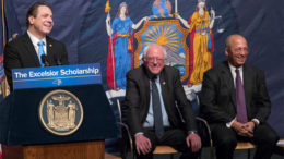 Andrew Cuomo (left) with Vermont Sen. Bernie Sanders (center) and William Thompson, board chair of the City University of New York, as the governor announces his free-tuition plan at LaGuardia Community College. Photo: AP/Mary Altaffer