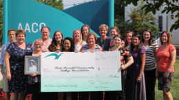 Employees from Anne Arundel Community College in Maryland display a check from a donor.